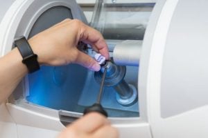 Cerec machine creating a tooth prosthesis
