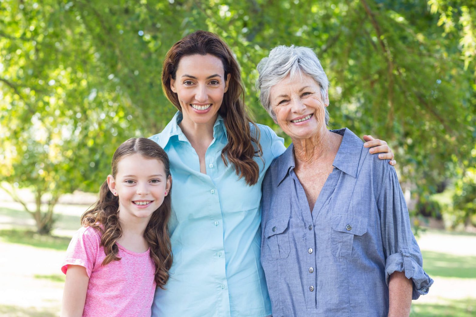 Three women smiling with white teeth